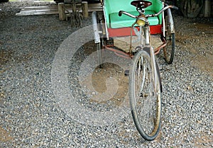 A classic rickshaw parked in the park, vinatage concept