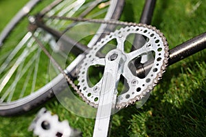 Classic road bicycle close-up photo in the summer green grass meadow field. Travel background