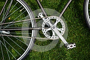 Classic road bicycle close-up photo in the summer green grass meadow field. Travel background