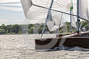 Classic sailing yacht with spinnaker on a lake in a regatta