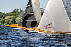 Classic sailing yachts on a lake in a regatta