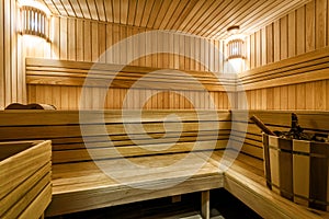 Classic sauna interior in Russia. Beautiful and clean wooden sauna. Modern nice bathroom for hot spa treatments