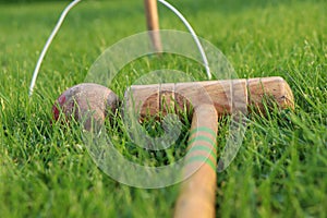 Classic set of vintage cricket stumps and bails and goals. Old wooden stick and devastate red ball. Game for all members of family photo