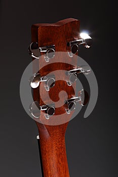Classic six-stringed wooden acoustic guitar head