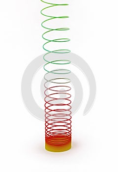 Classic spring toy stretched up on a white background