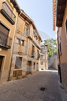 Classic street of the former Jewish quarter La Juderia of the medieval city of Segovia, Spain photo
