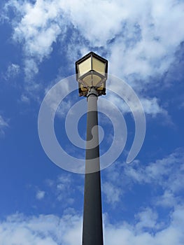 Classic street lamp under blue sky. View from below of Walkway garden ground lamp. Outdoor vintage lamppost