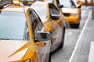 Classic street view of yellow cabs in New York city