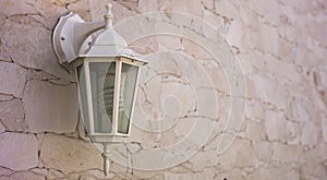 Classic style hanging lamp on stoned facade