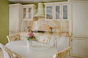 Classic style kitchen and dining room interior in beige pastoral colors