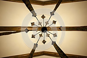 Classic style. Vintage or retro interior design. Old ceiling. Wood beam ceiling. Decorative lamp hanging from ceiling. Classic
