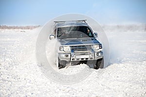 Classic SUV moving in deep snow