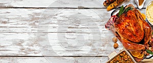 Classic Thanksgiving turkey dinner side border on a rustic white wood banner background