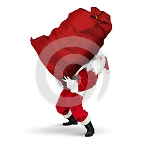 Classic traditional crazy funny santa claus on exhausting delivery service. carrying huge giant big red bag with christmas gift photo