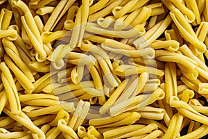 Classic uncooked casarecce pasta background