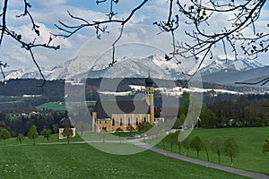 Classic view of famous Wilparting Pilgrimage Church with green meadows and trees in springtime, Irschenberg, Upper