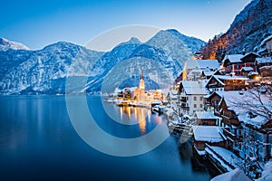 Classic view of Hallstatt with ship in winter twilight, Salzkammergut, Austria