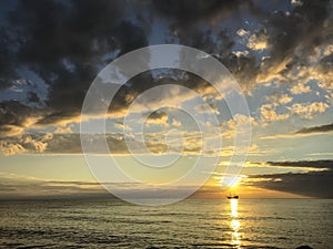 Classic viking ship sailing in the sea sunset