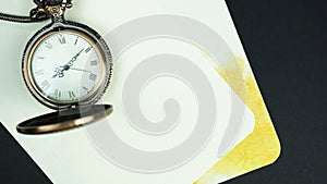 Classic vintage background with old pocket watch and note paper
