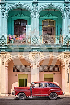 Classic vintage car and coloful colonial buildings in Old Havana