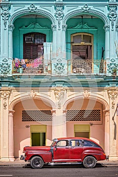 Classic vintage car and coloful colonial buildings in Old Havana photo