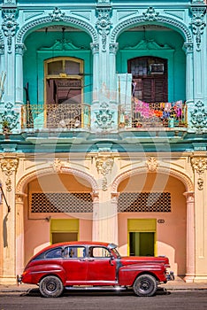 Classic vintage car and colorful colonial buildings in Old Havana Cuba
