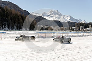 A classic vintage car on the frozen lake of St Moritz in winter