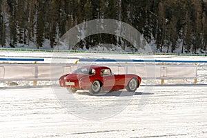 A classic vintage car on the frozen lake of St Moritz in winter