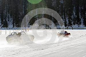 A classic vintage car on the frozen lake of St Moritz in winter