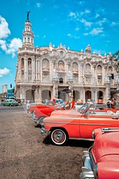 Classic vintage cars next to the beautiful Great Theater of Havana
