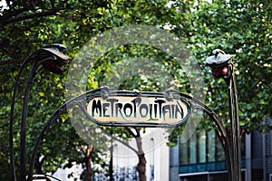 Classic vintage sign sign pointing to the entrance to the metro station in Paris