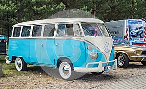 Classic vintage white and blue VW Transporter camper parked