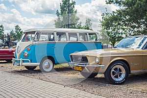 Classic vintage white and blue VW Transporter camper parked