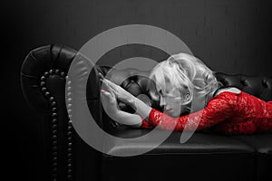 Classic Vintage woman lying on the couch 1920 black white and red