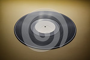 Classic vinyl record close-up on a yellow background, obsolete data storage, music