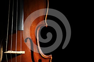 Classic violin on black background. Space for text