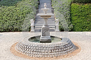 Classic water fountain in the garden.