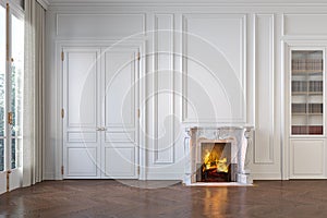 Classic white empty interior with fireplace, moldings, wall pannel, window, door.