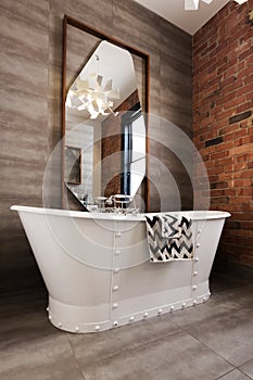 Classic white freestanding iron look bathtub in renovated bathroom