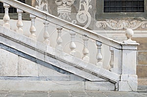 Classic white marble railing on the outside of an historic building in Italy