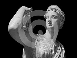 Classic white marble statuette Diana of Versailles isolated on black background. Scilpture of huntress