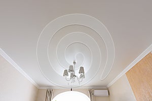 Classic white matte ceiling in the hall