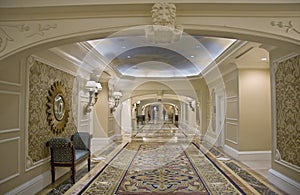 Classic wide corridor with settee and carpet photo