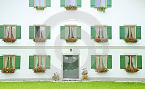 Classic window and door on white wall.