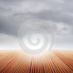 Classic Wood floor and rainclouds for background photo