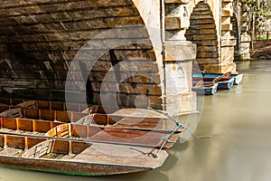 Classic wooden boats docked on the river in Oxford - 8