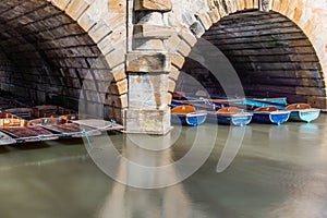 Classic wooden boats docked on the river in Oxford - 4