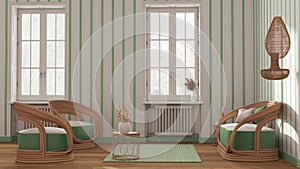 Classic wooden living room in white and green tones, rattan sofa and armchairs, side tables and carpet. Windows, striped wallpaper