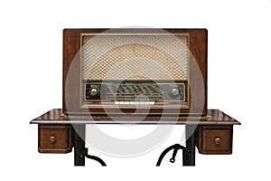 The classic wooden radio on the table made from sawing machine