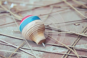 Classic wooden spinning top toy with string